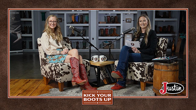 Taylor McAdams has blonde hair and is sitting next to Kalyn Grokett with blonde hair, wearing a skirt and red boots, looking at the camera, smiling, sitting, and having a conversation.